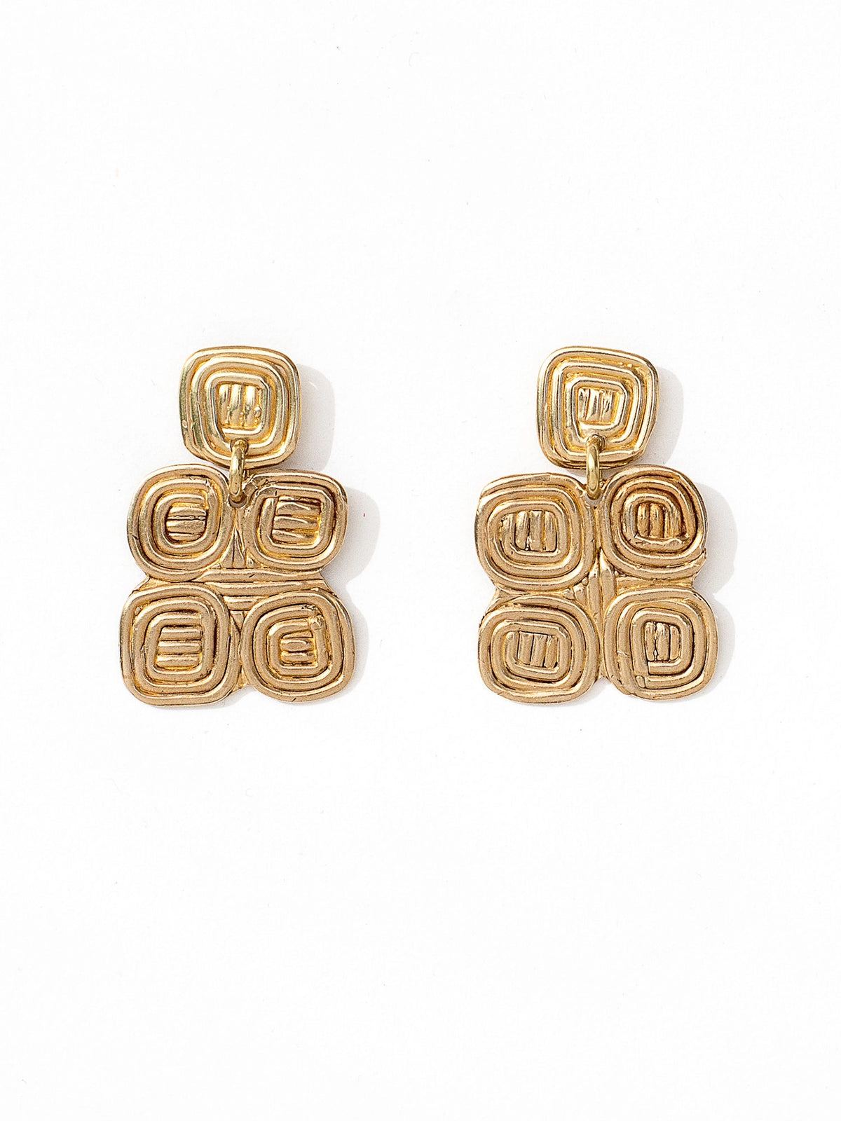 A pair of brass spiral chandelier statement earrings by contemporary designer Michelle Ross