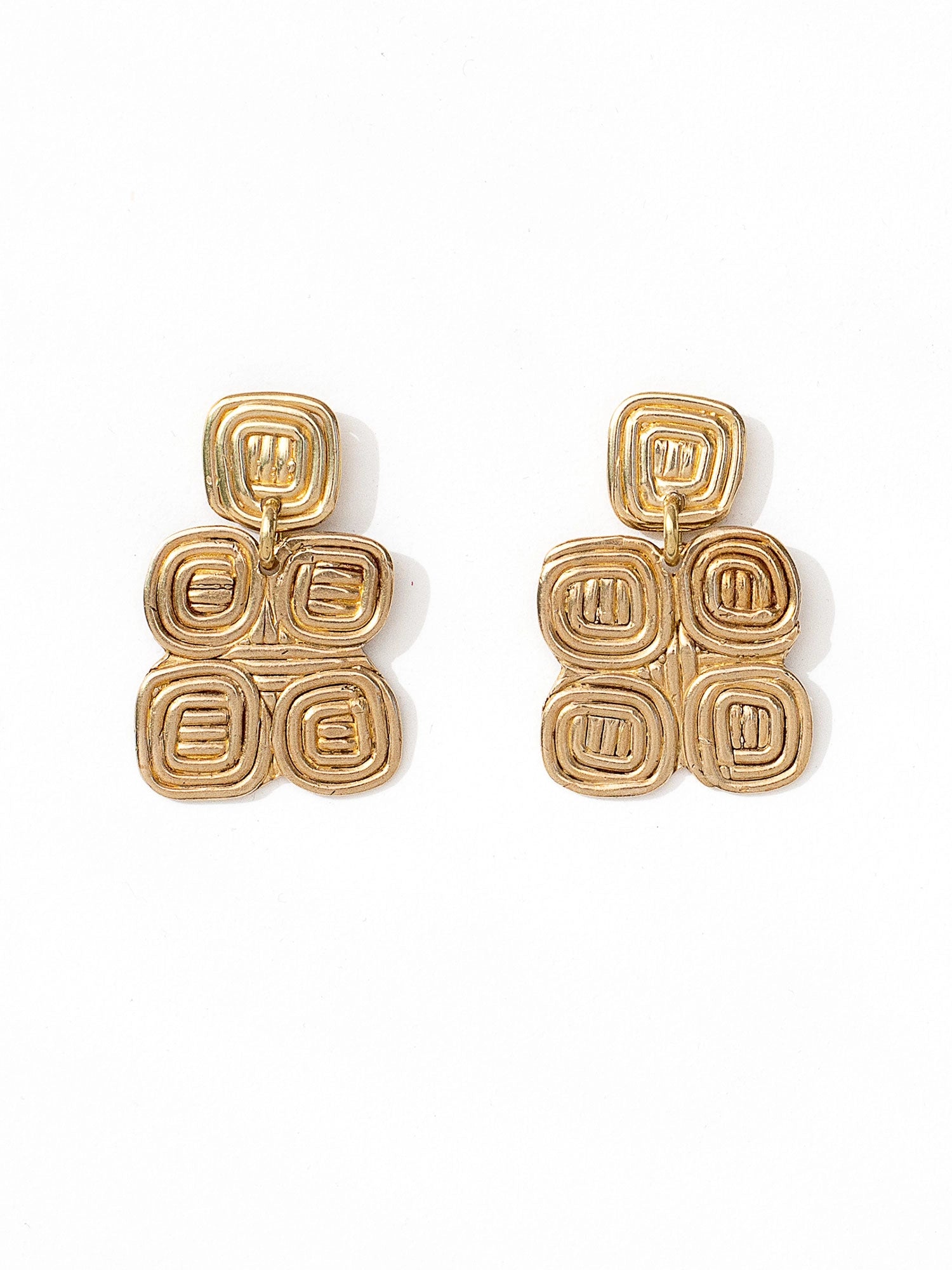 A pair of brass spiral chandelier statement earrings by contemporary designer Michelle Ross