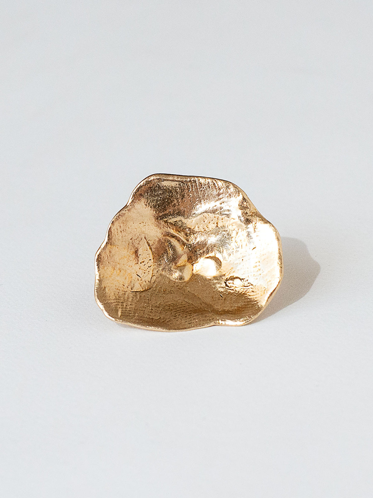 A sculptural statement ring in solid brass handmade by Michelle Ross in Toronto, Canada