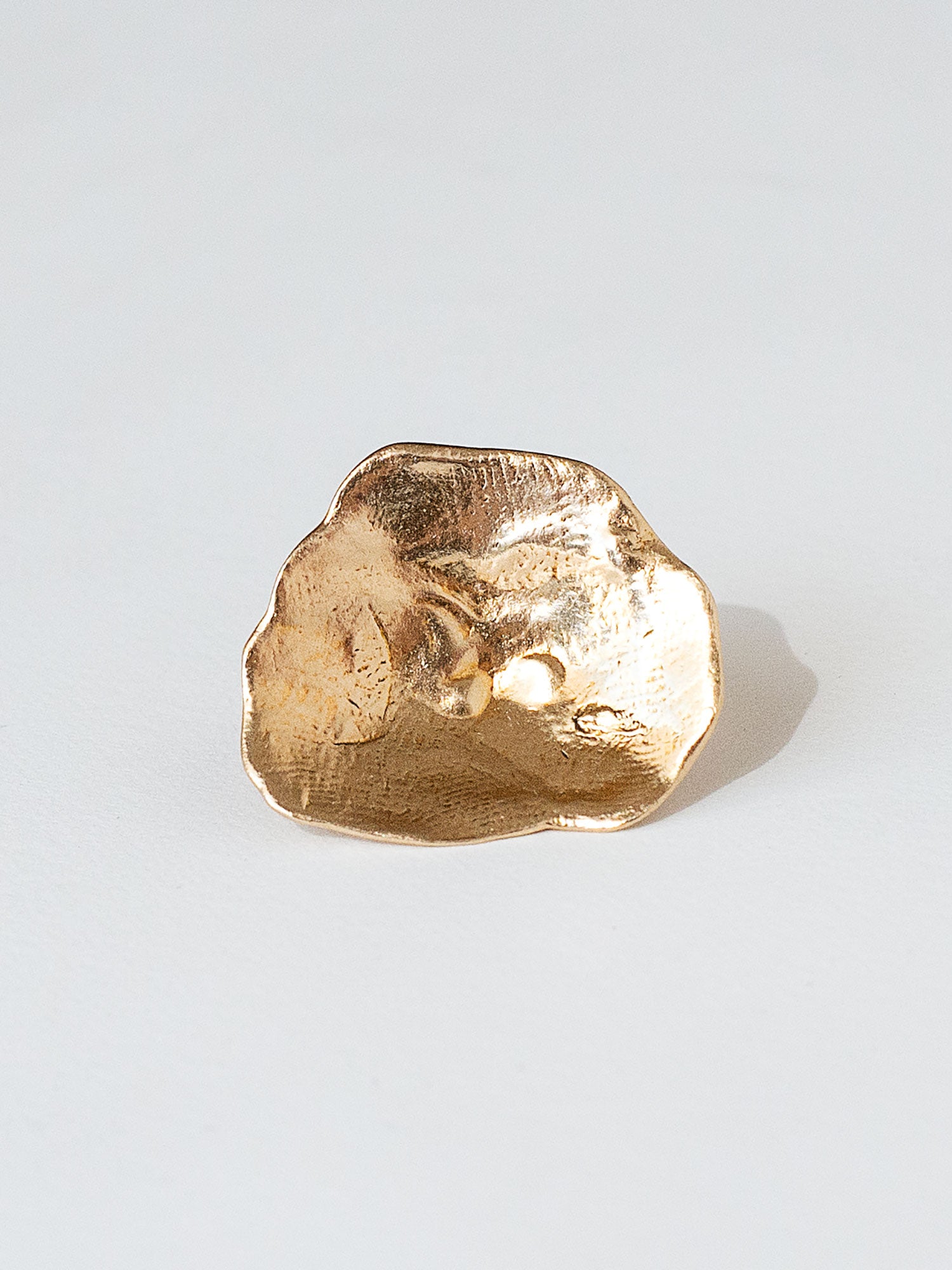 A sculptural statement ring in solid brass handmade by Michelle Ross in Toronto, Canada