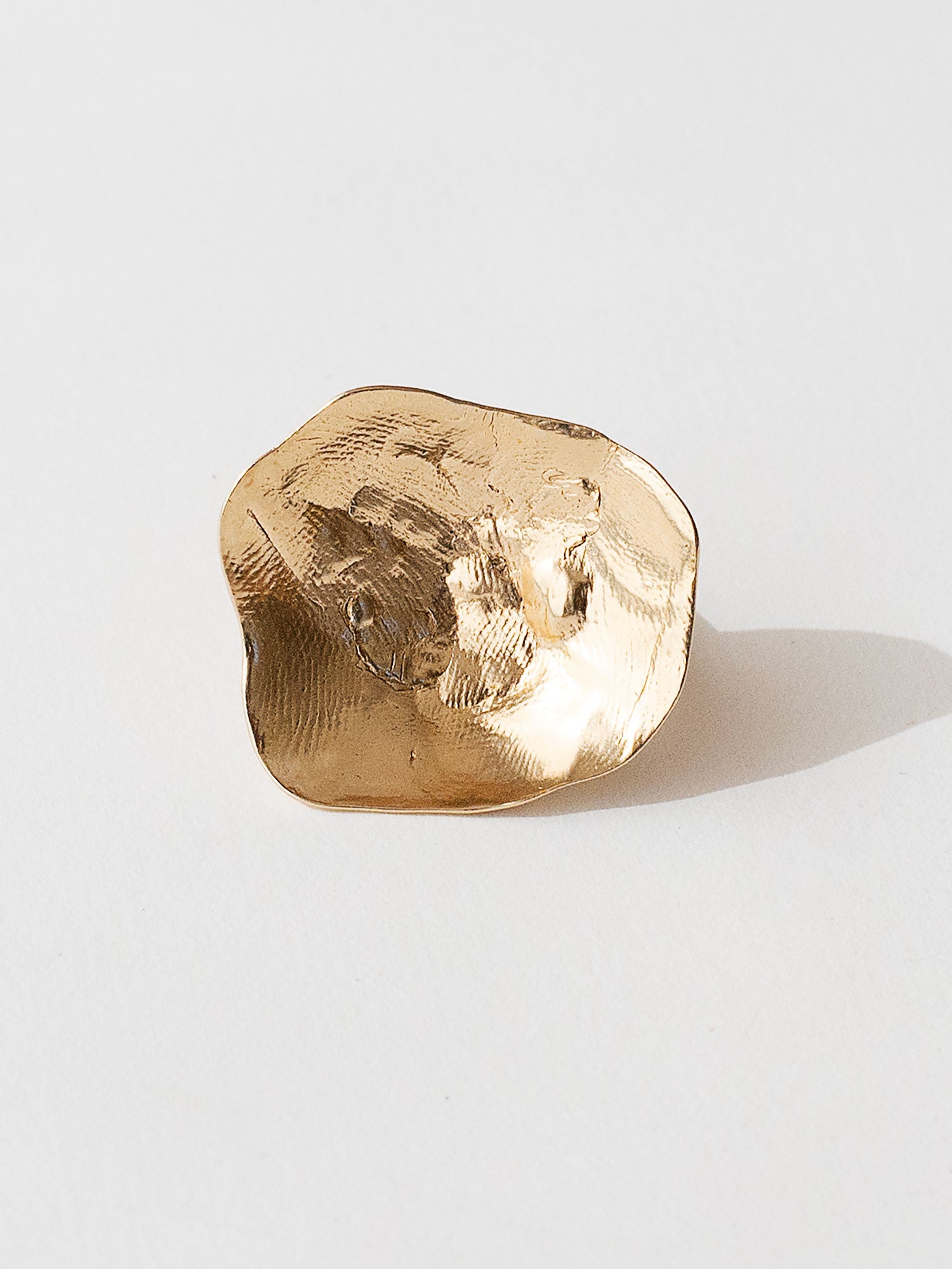 A sculptural statement ring in solid brass handmade by Michelle Ross in Toronto, Canada