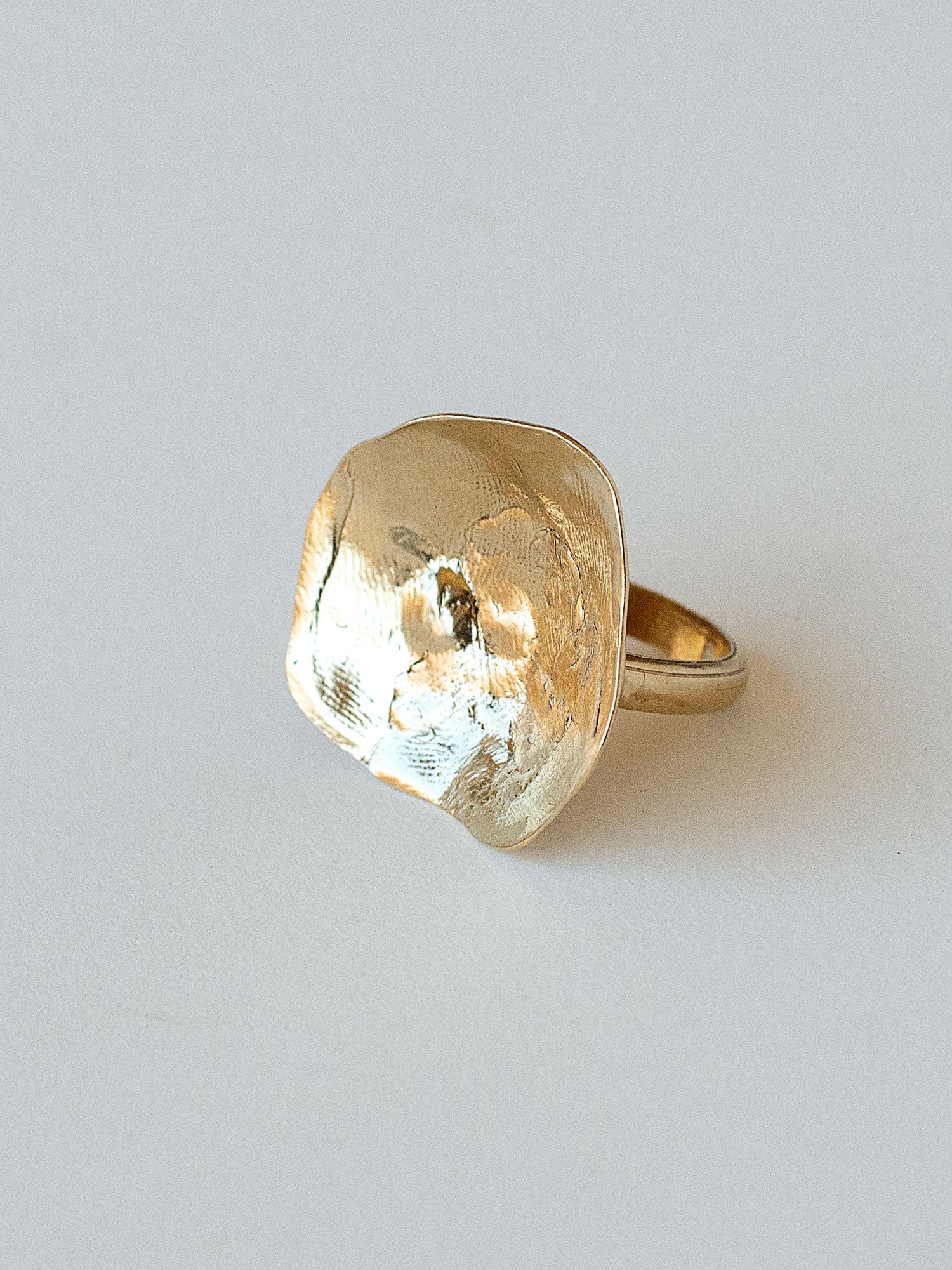 A sculptural statement ring in solid brass handmade by Michelle Ross in Toronto, Canada