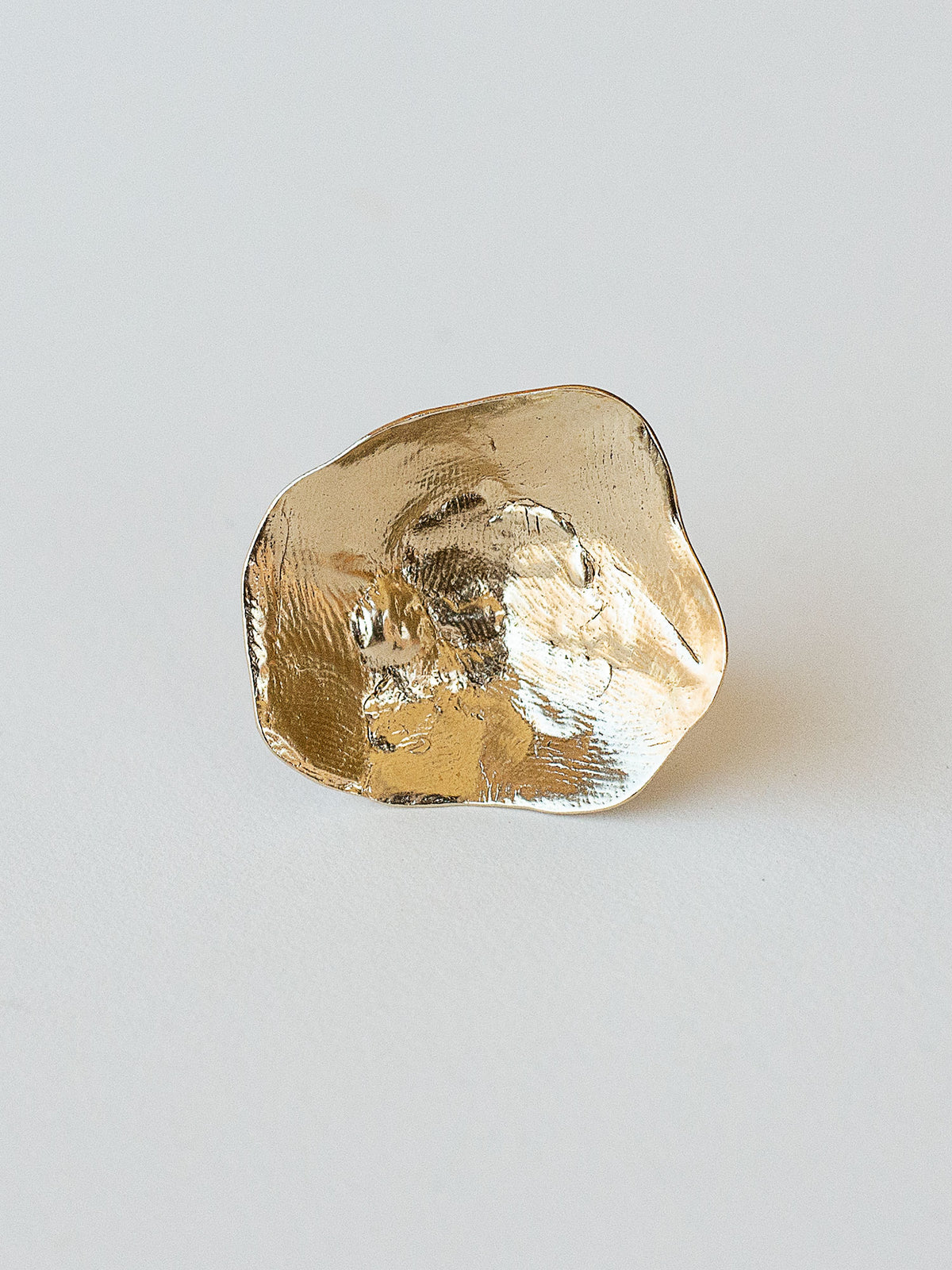 A sculptural statement ring in solid brass handmade by Michelle Ross in Toronto, Canada