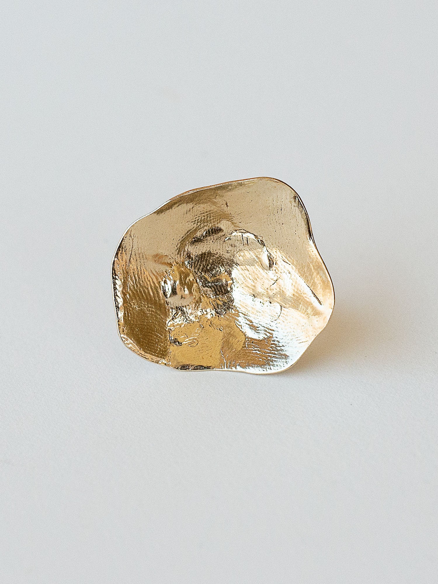 A sculptural statement ring in solid brass handmade by Michelle Ross in Toronto, Canada