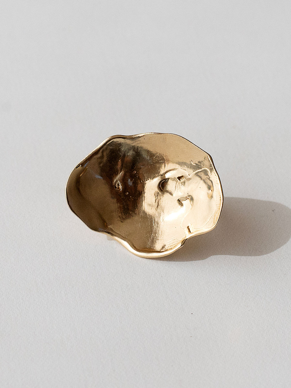 A sculptural statement ring in solid brass handmade by Michelle Ross in Toronto, Canada