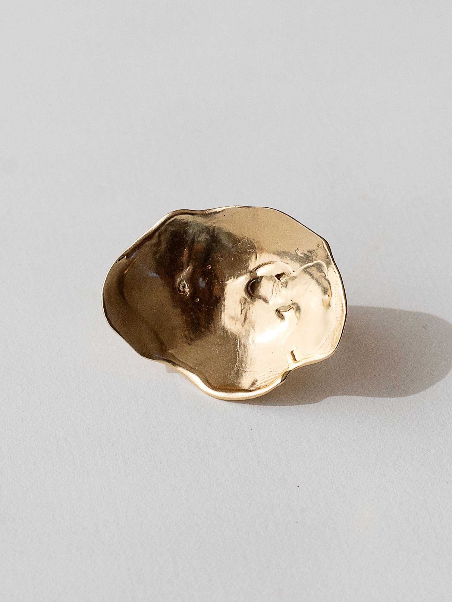A sculptural statement ring in solid brass handmade by Michelle Ross in Toronto, Canada