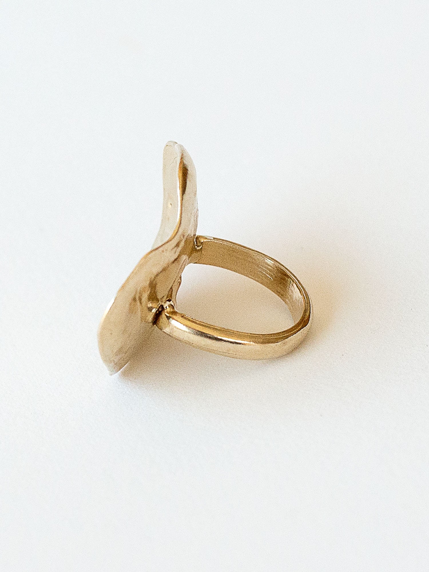 A sculptural statement ring in solid brass handmade by Michelle Ross in Toronto, Canada