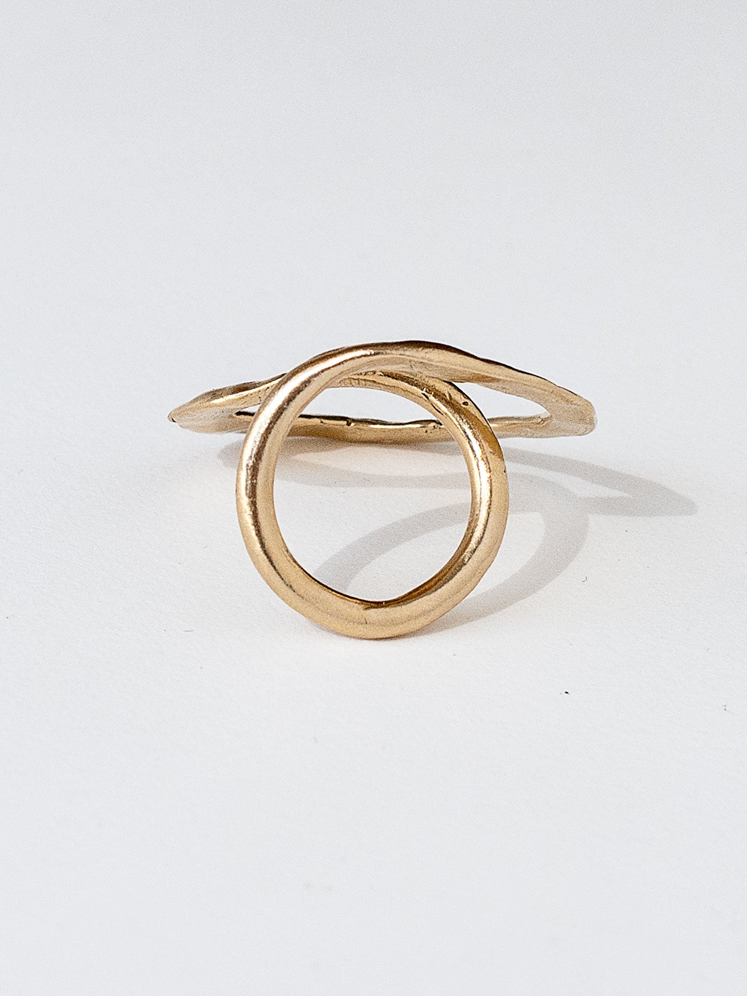 A handmade solid brass ring in an artistic twisting shape by Michele Ross in Toronto, Canada