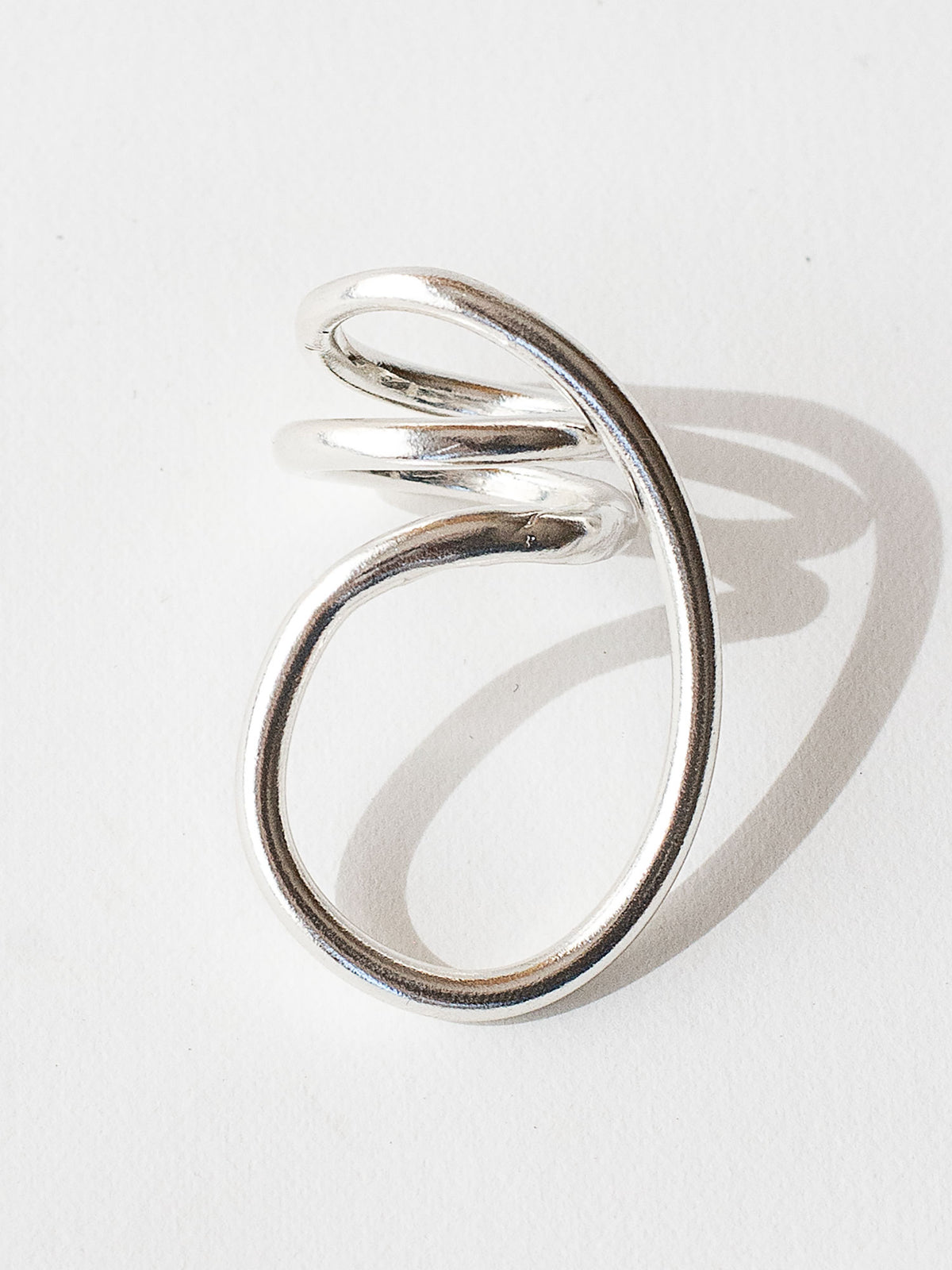 A handmade solid sterling silver ring in an artistic twisting shape by Michele Ross in Toronto, Canada