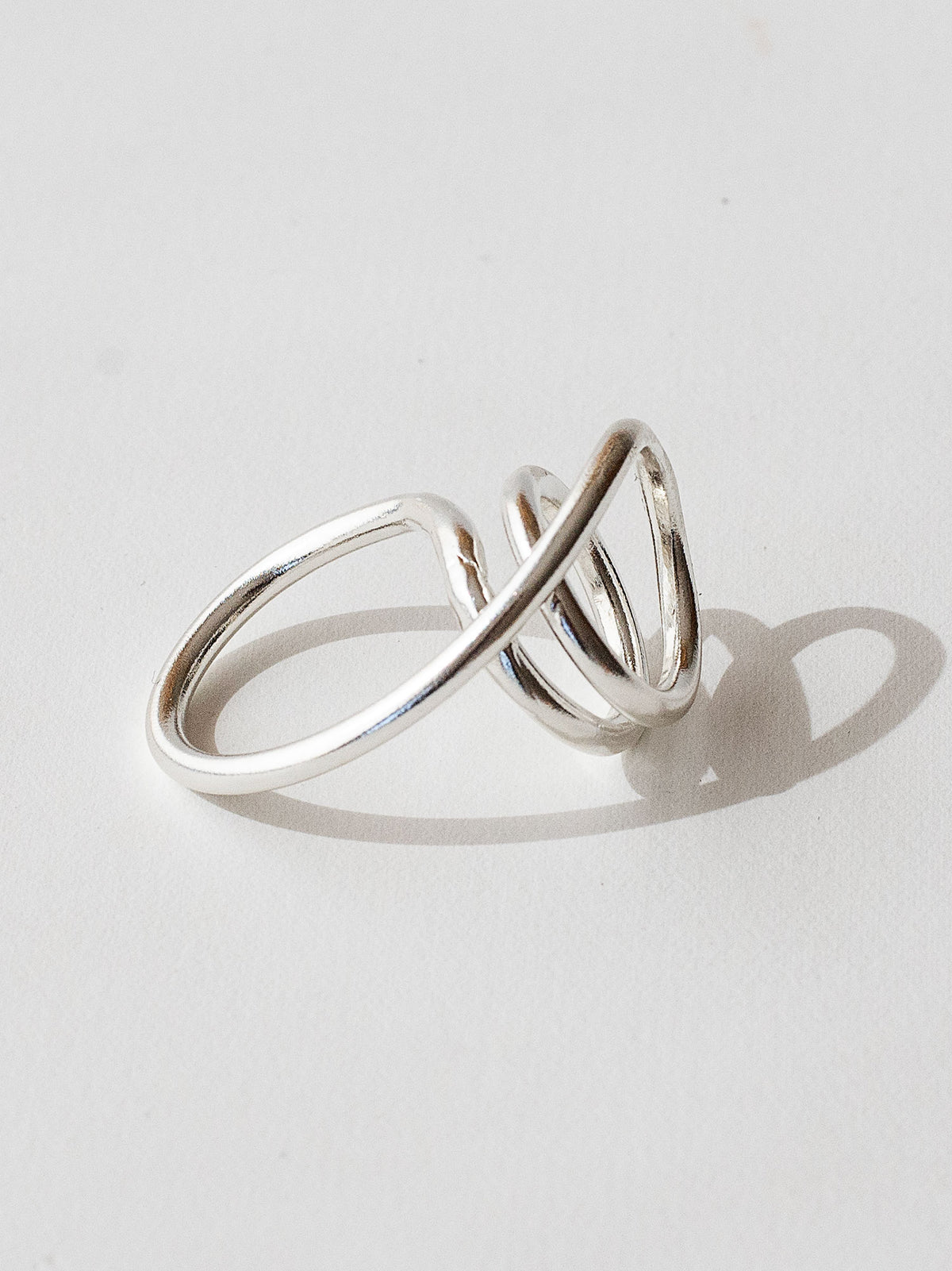 A handmade solid sterling silver ring in an artistic twisting shape by Michele Ross in Toronto, Canada