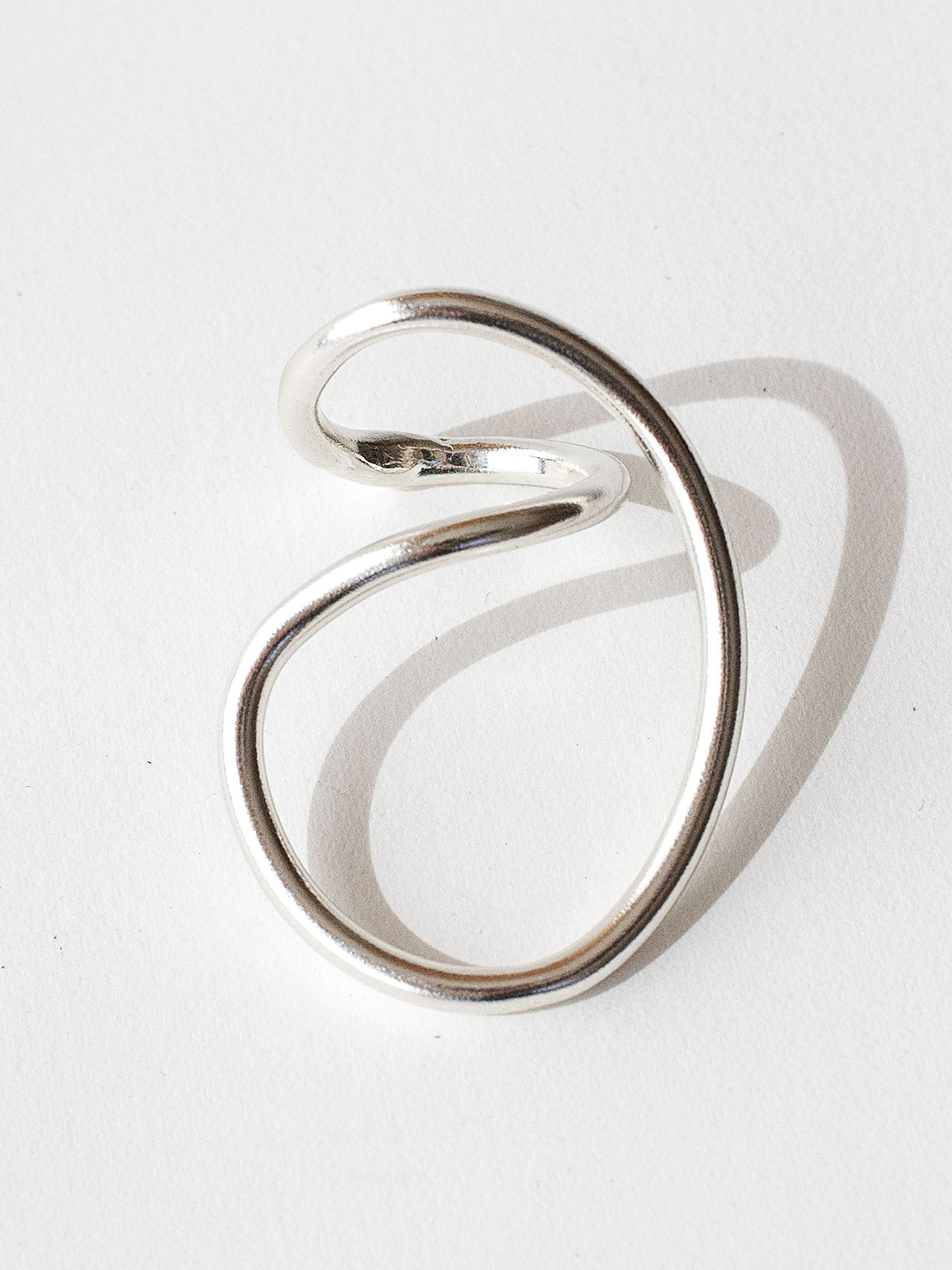 A handmade solid sterling silver ring in an artistic twisting shape by Michele Ross in Toronto, Canada