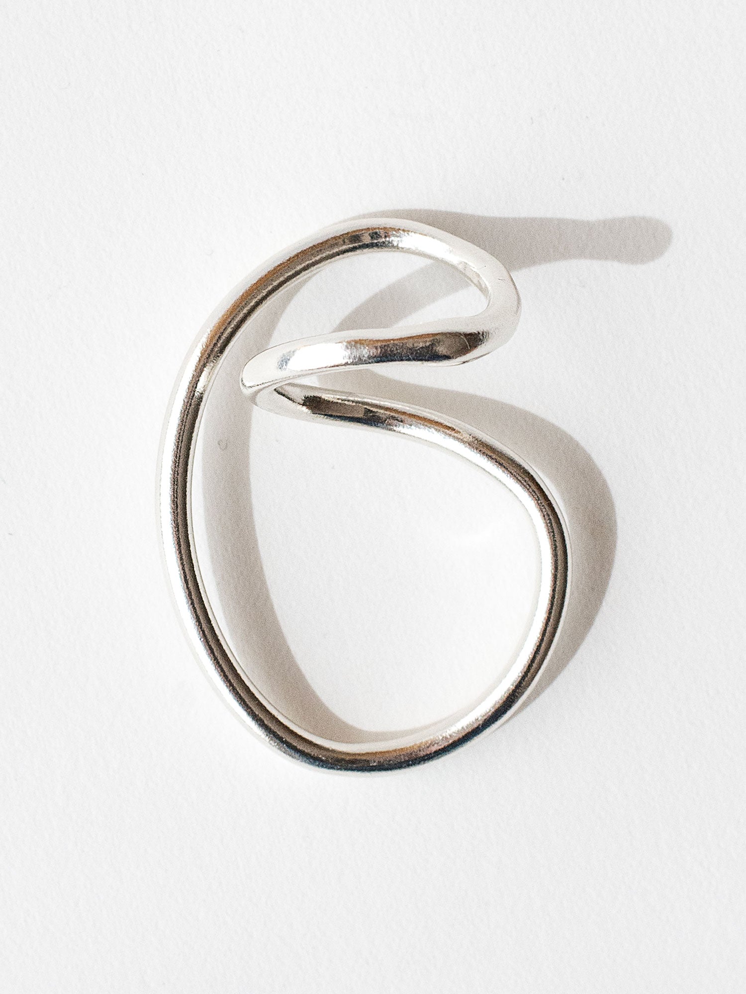 A handmade solid sterling silver ring in an artistic twisting shape by Michele Ross in Toronto, Canada
