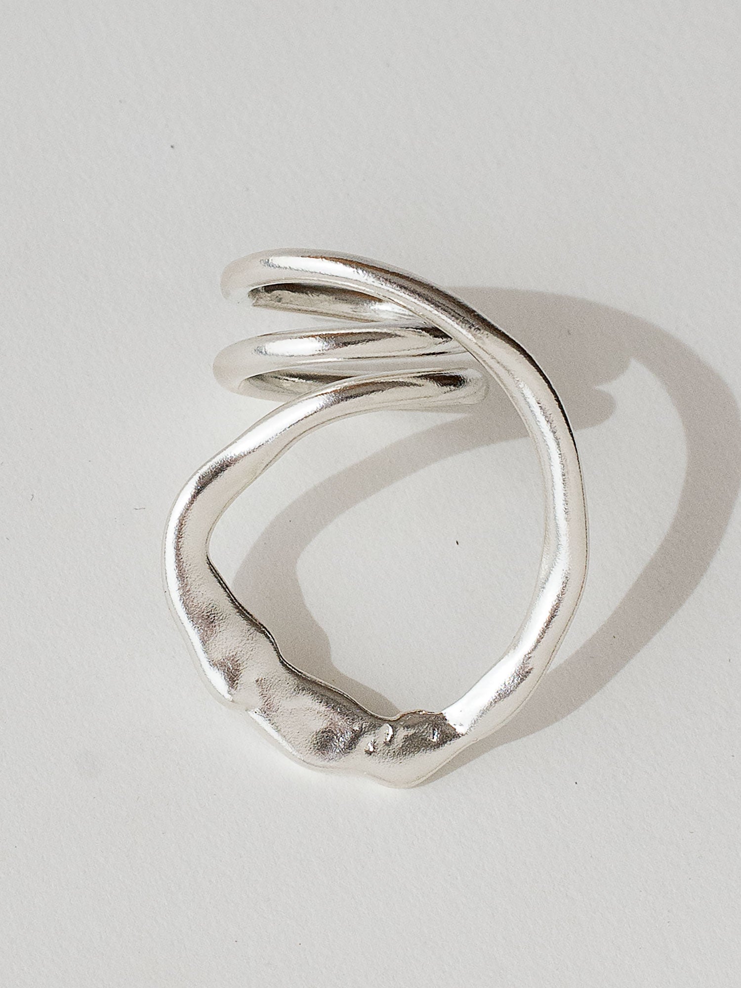 A handmade solid sterling silver ring in an artistic twisting shape by Michele Ross in Toronto, Canada