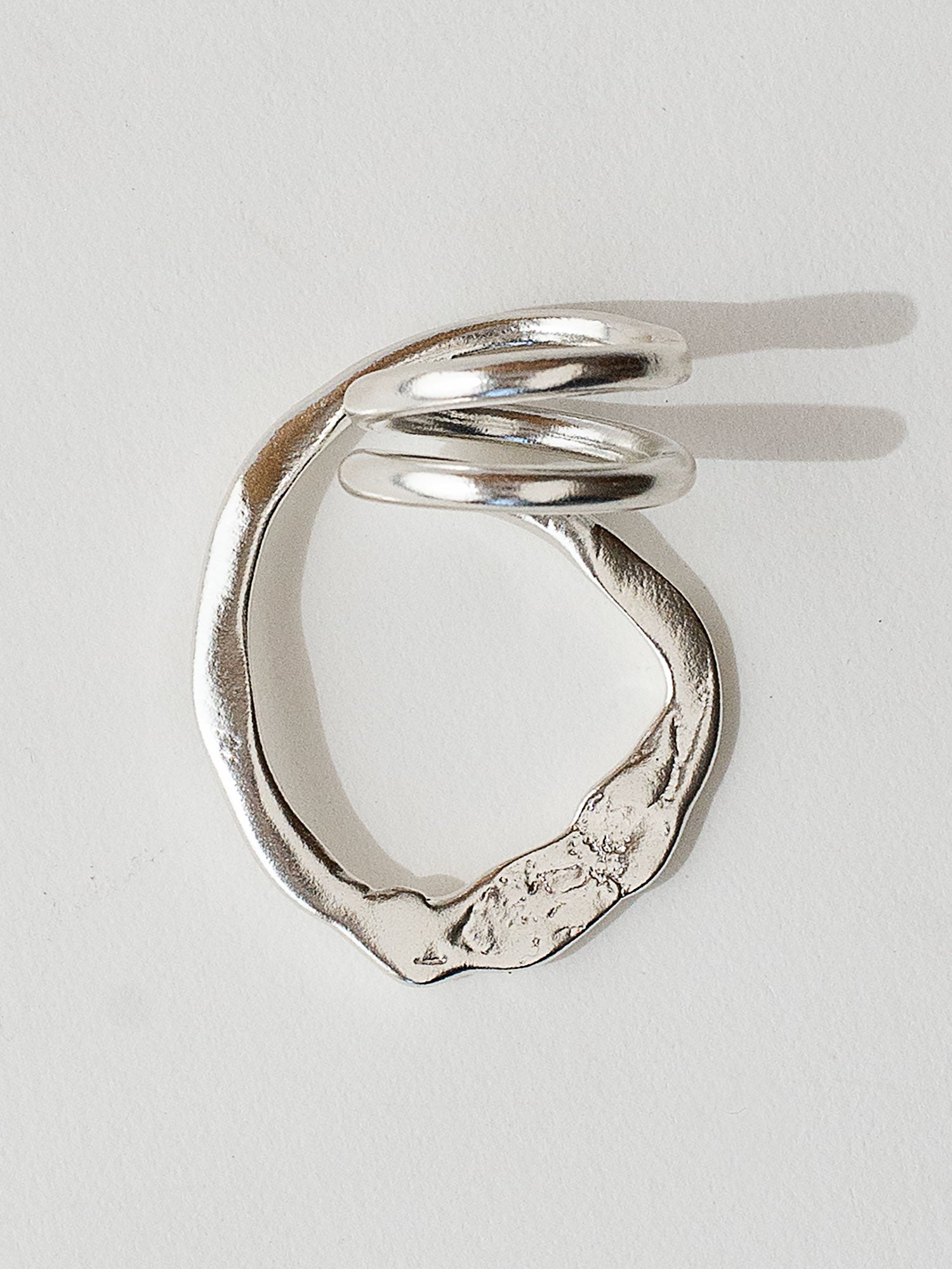 A handmade solid sterling silver ring in an artistic twisting shape by Michele Ross in Toronto, Canada