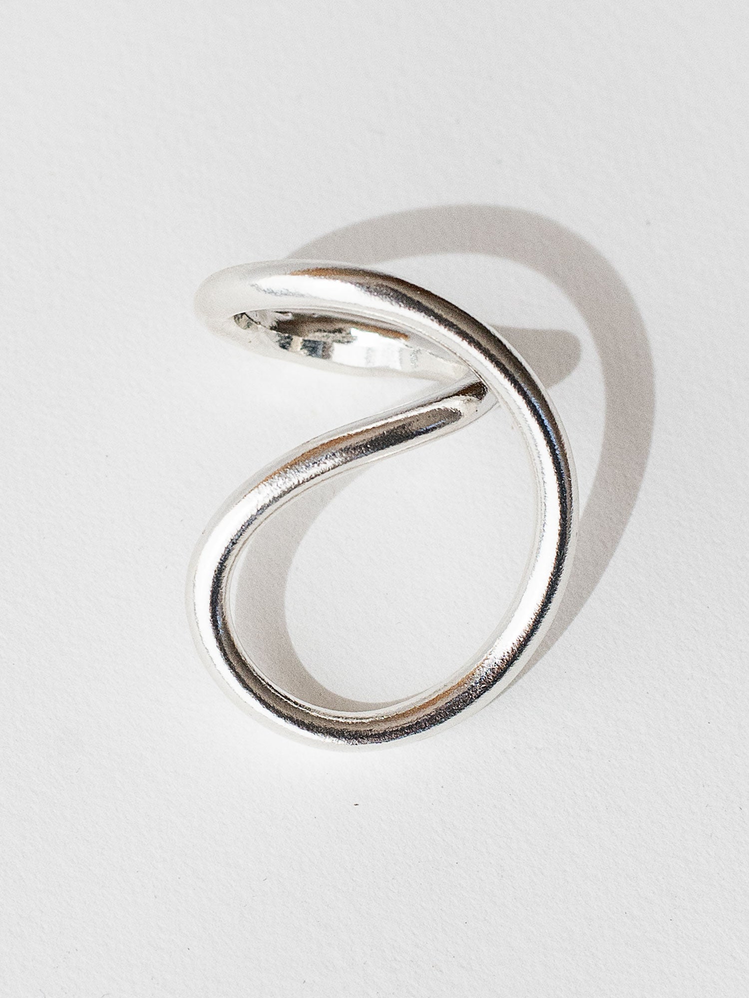 A handmade solid sterling silver ring in an artistic twisting shape by Michele Ross in Toronto, Canada