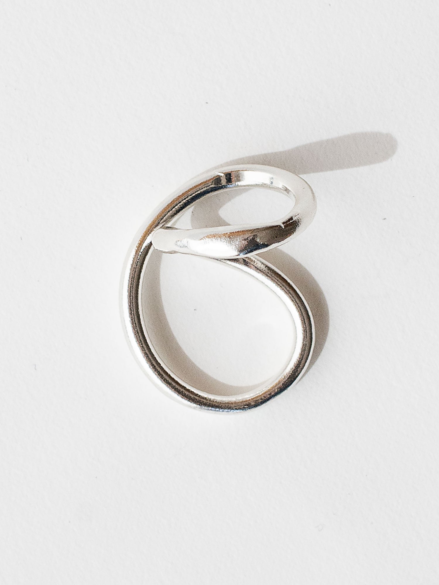 A handmade solid sterling silver ring in an artistic twisting shape by Michele Ross in Toronto, Canada