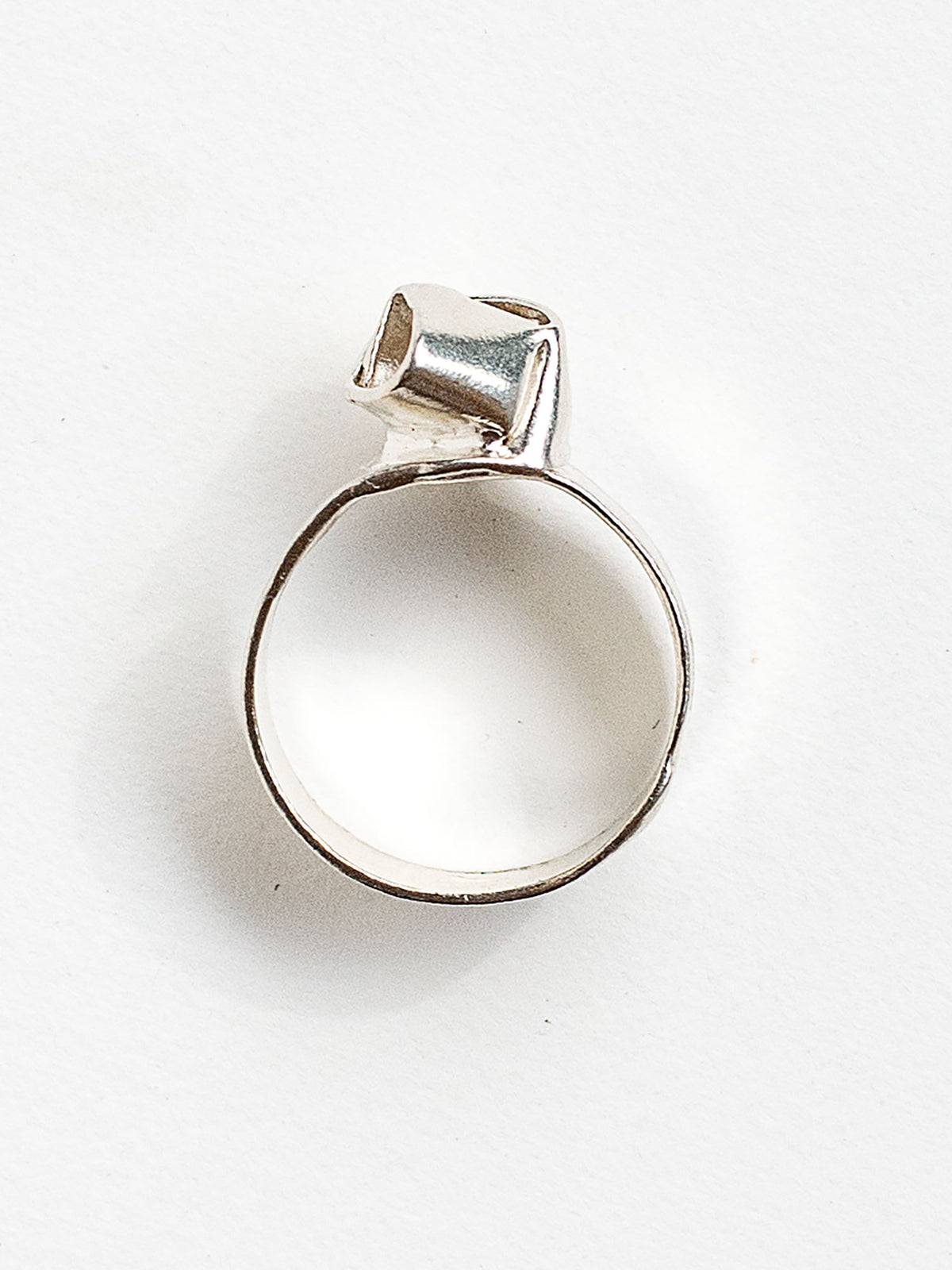 A sterling silver ring with a knot design made in Toronto by Canadian jewelry designer Michelle Ross