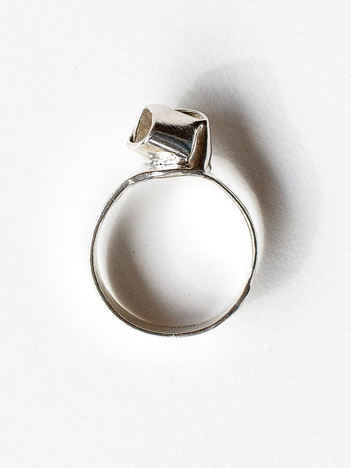 A sterling silver ring with a knot design made in Toronto by Canadian jewelry designer Michelle Ross