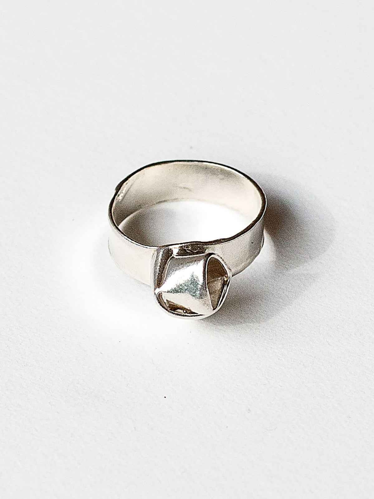A sterling silver ring with a knot design made in Toronto by Canadian jewelry designer Michelle Ross