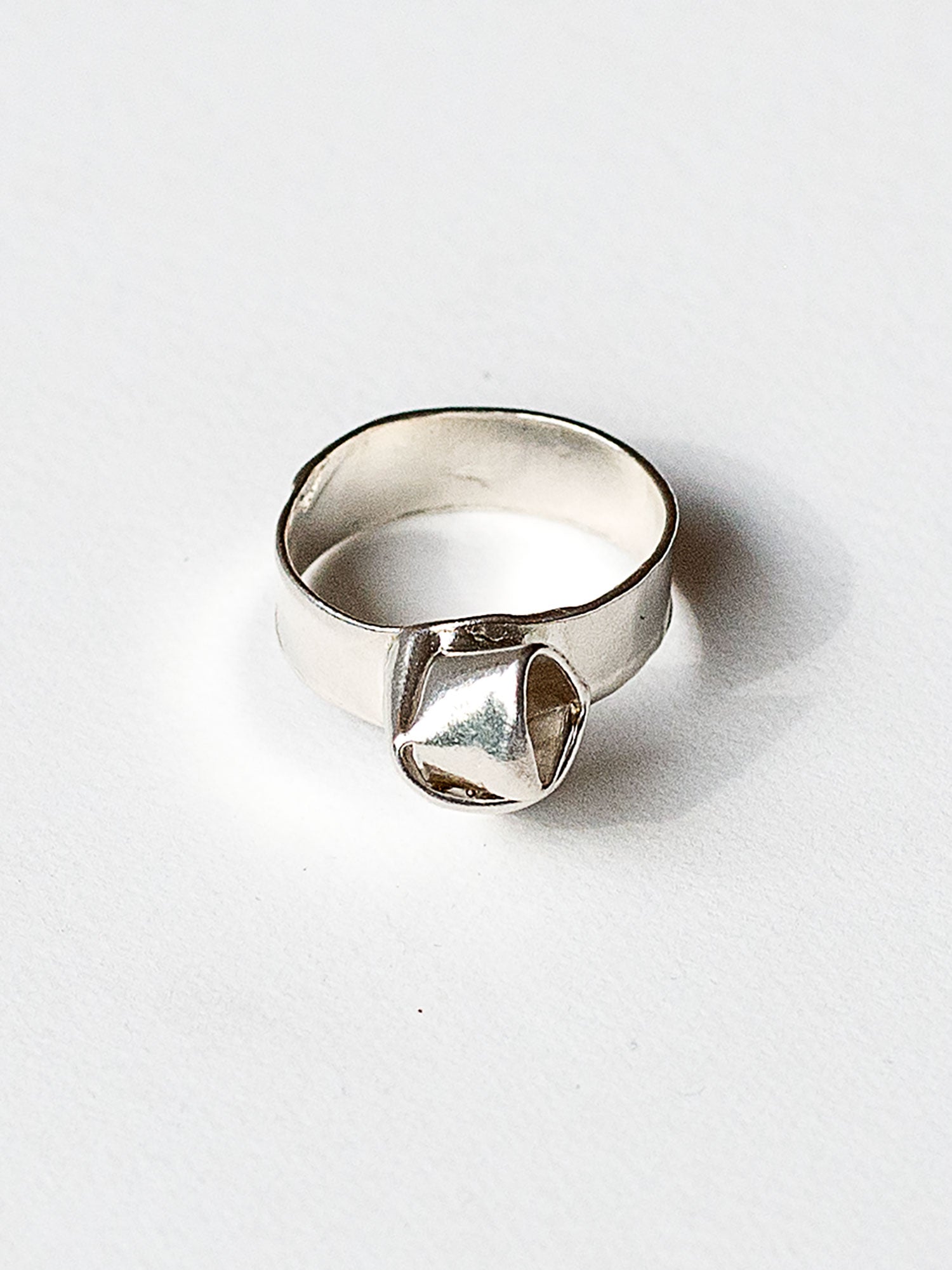 A sterling silver ring with a knot design made in Toronto by Canadian jewelry designer Michelle Ross
