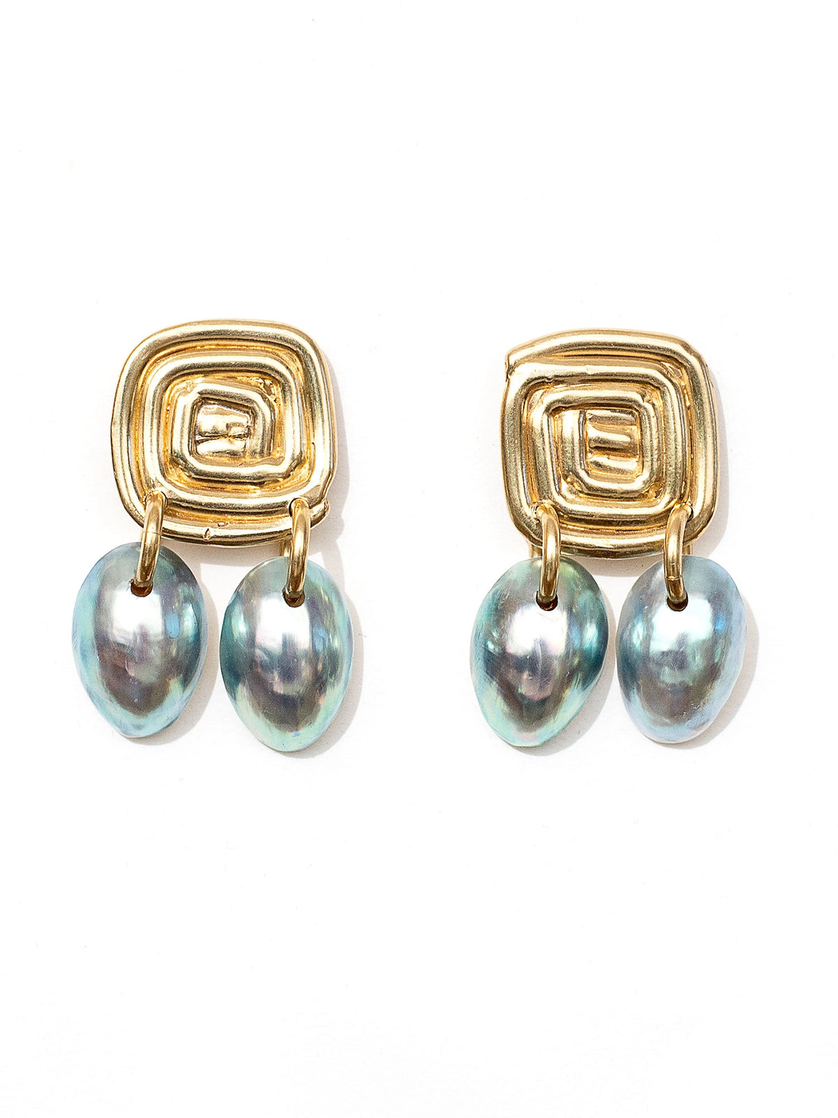 Three pairs of shell and brass statement dangly earrings by Canadian jewelry designer Michelle Ross