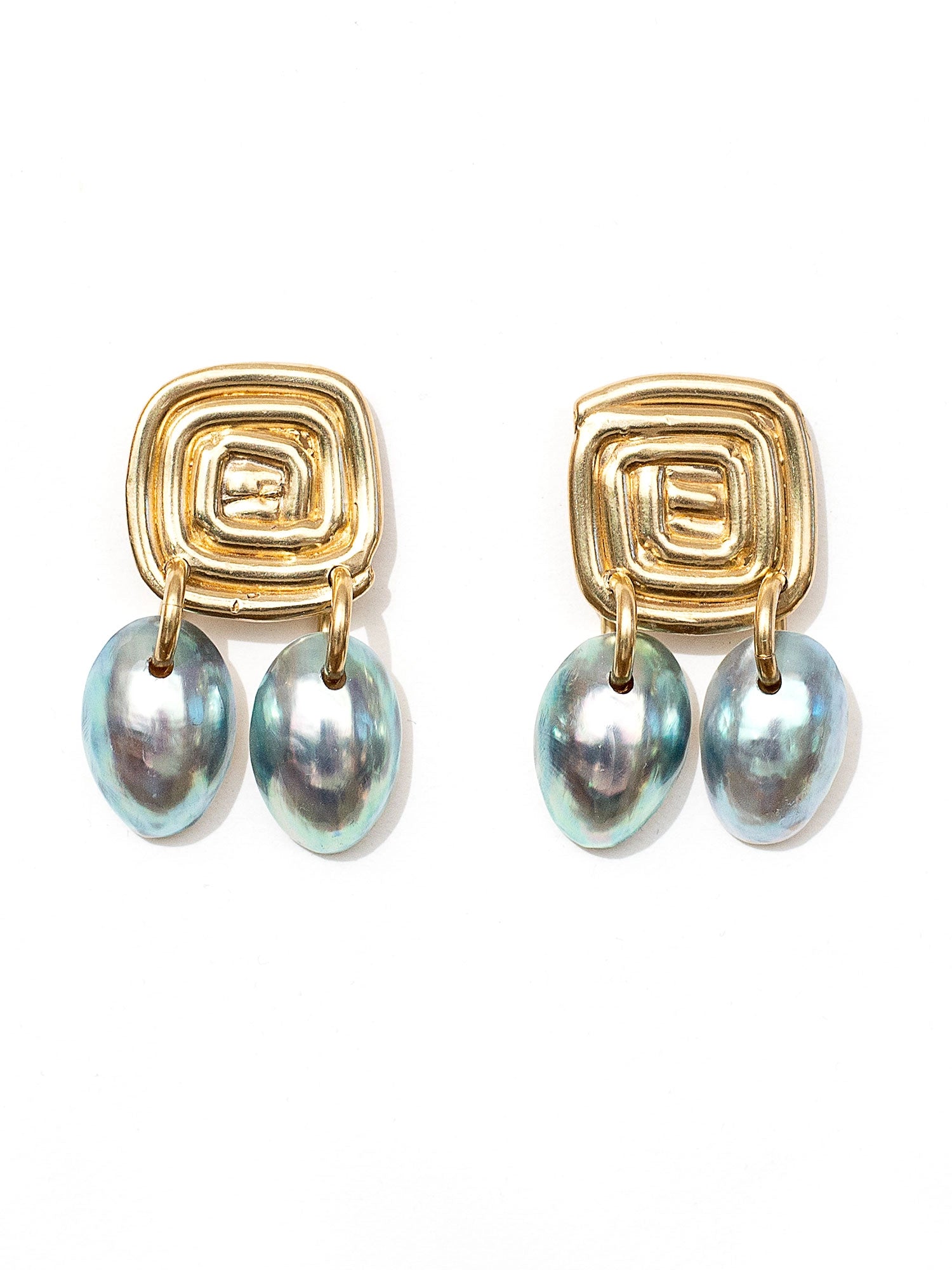 Three pairs of shell and brass statement dangly earrings by Canadian jewelry designer Michelle Ross