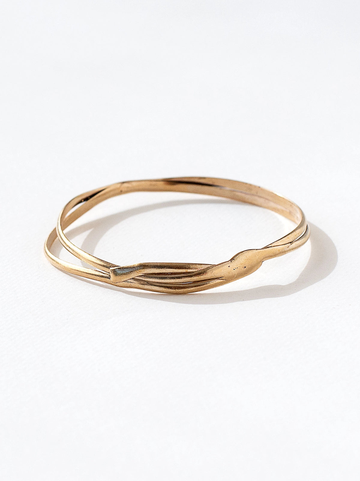 A solid brass stacked bangle bracelet by Canadian jewelry designer Michelle Ross