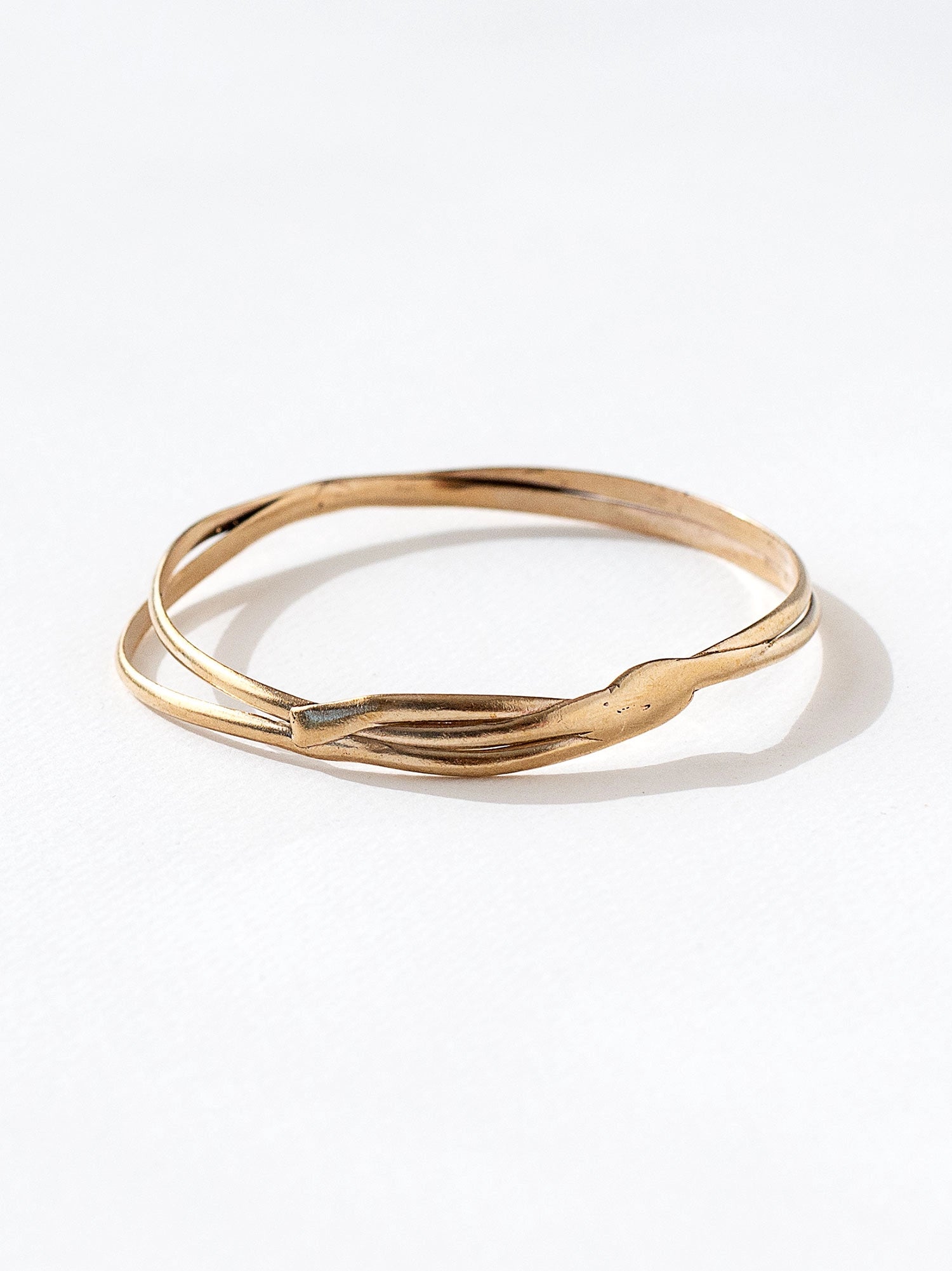 A solid brass stacked bangle bracelet by Canadian jewelry designer Michelle Ross