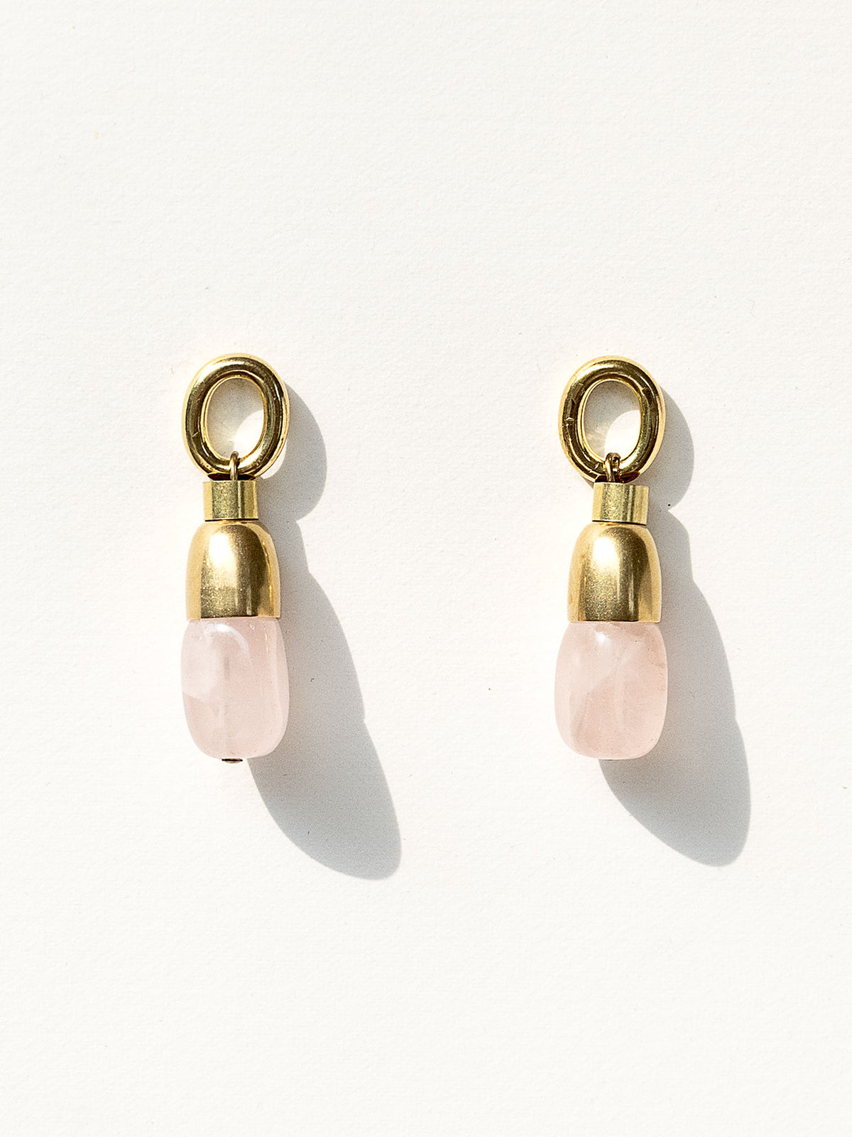 A pair of brass and rose quartz drop earrings by Canadian jewelry designer Michelle Ross