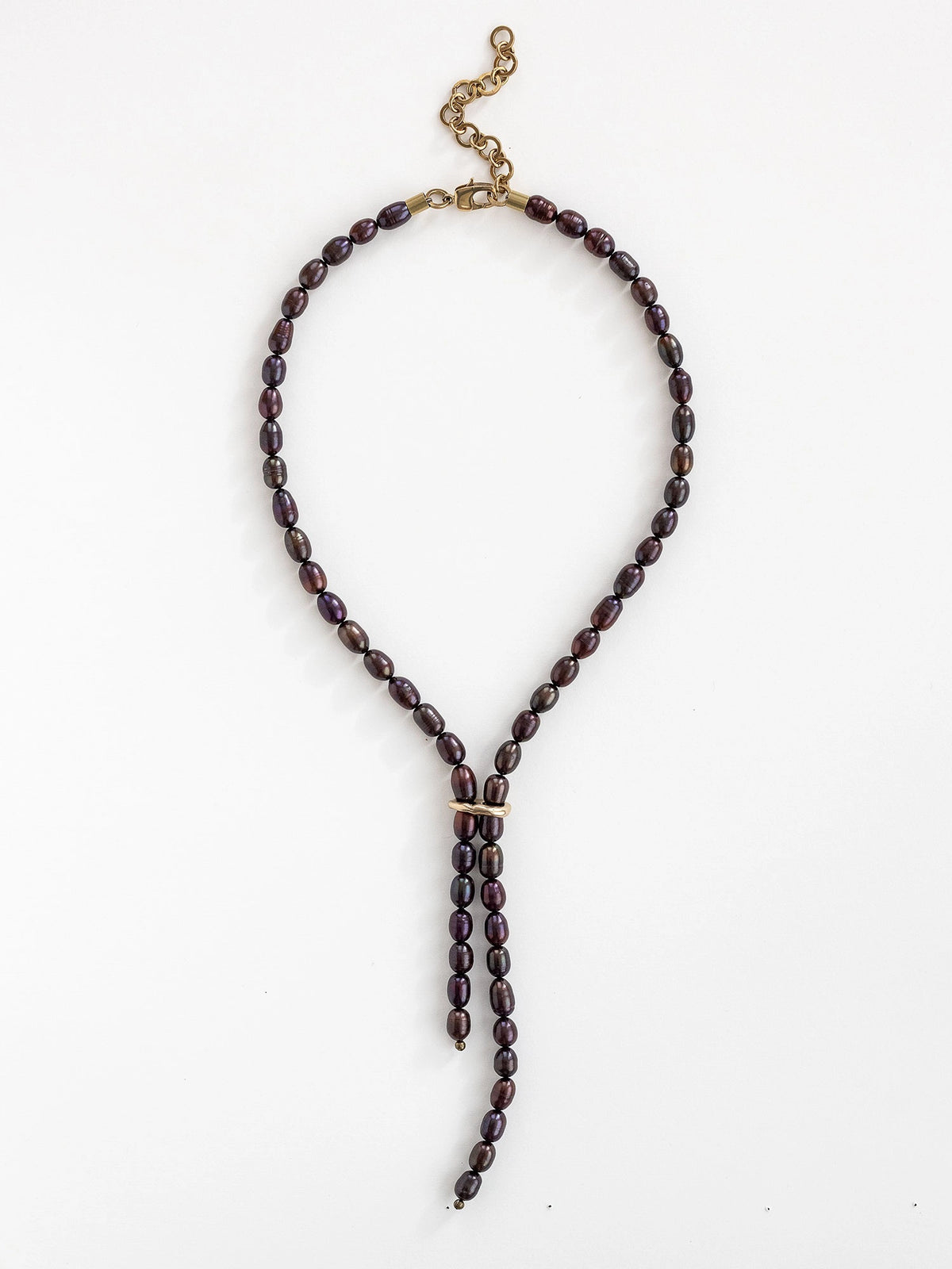 Lariat style necklace with espresso pearl beads and a brass clasp by Michelle Ross