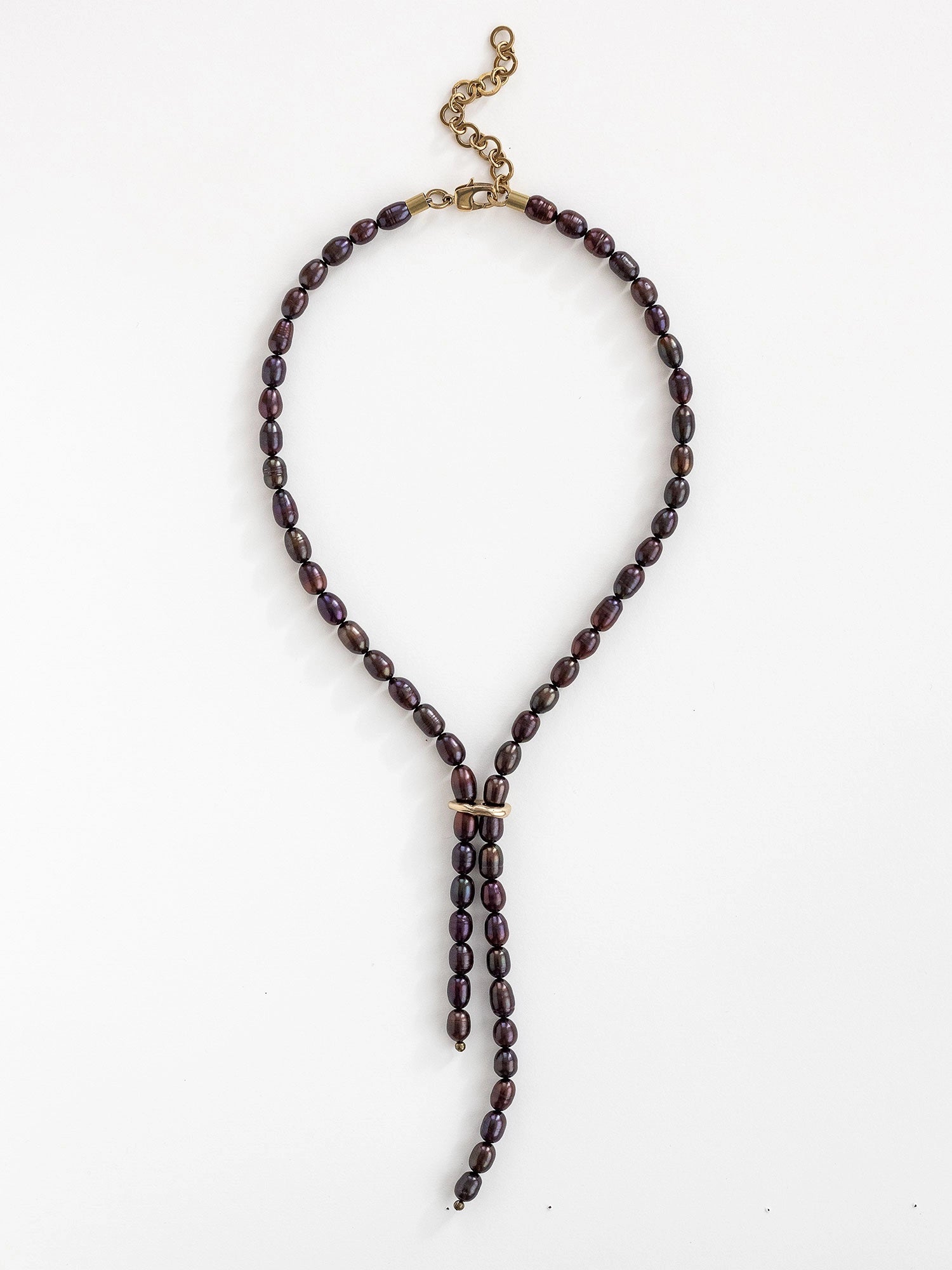 Lariat style necklace with espresso pearl beads and a brass clasp by Michelle Ross