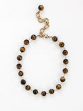 A brass and beaded chain necklace with tigers eye by Michelle Ross