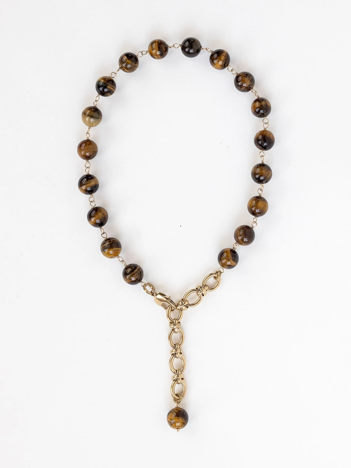 A brass and beaded chain necklace with tigers eye by Michelle Ross