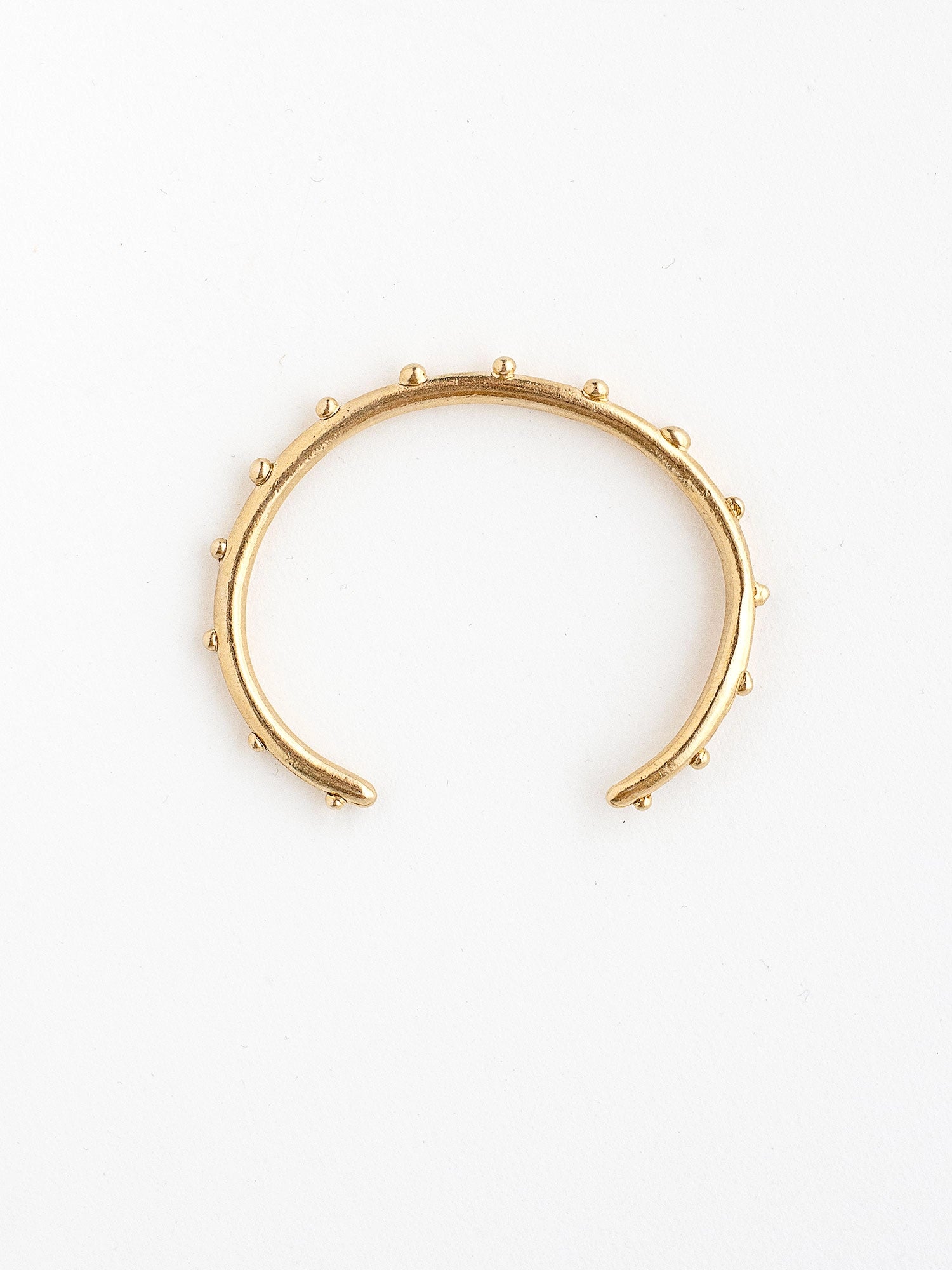A handmade brass bangle bracelet by Michelle Ross
