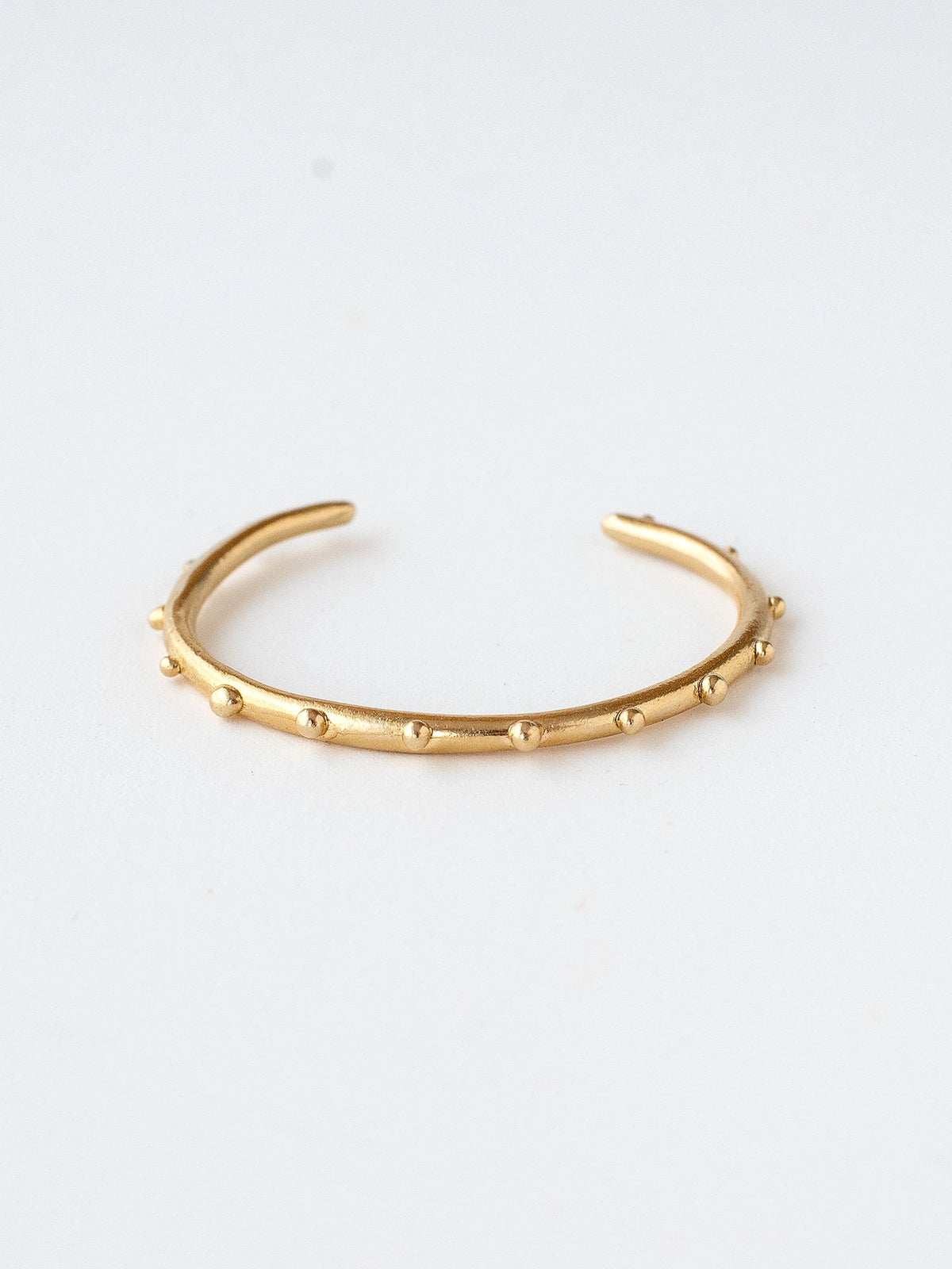 A handmade brass bangle bracelet by Michelle Ross