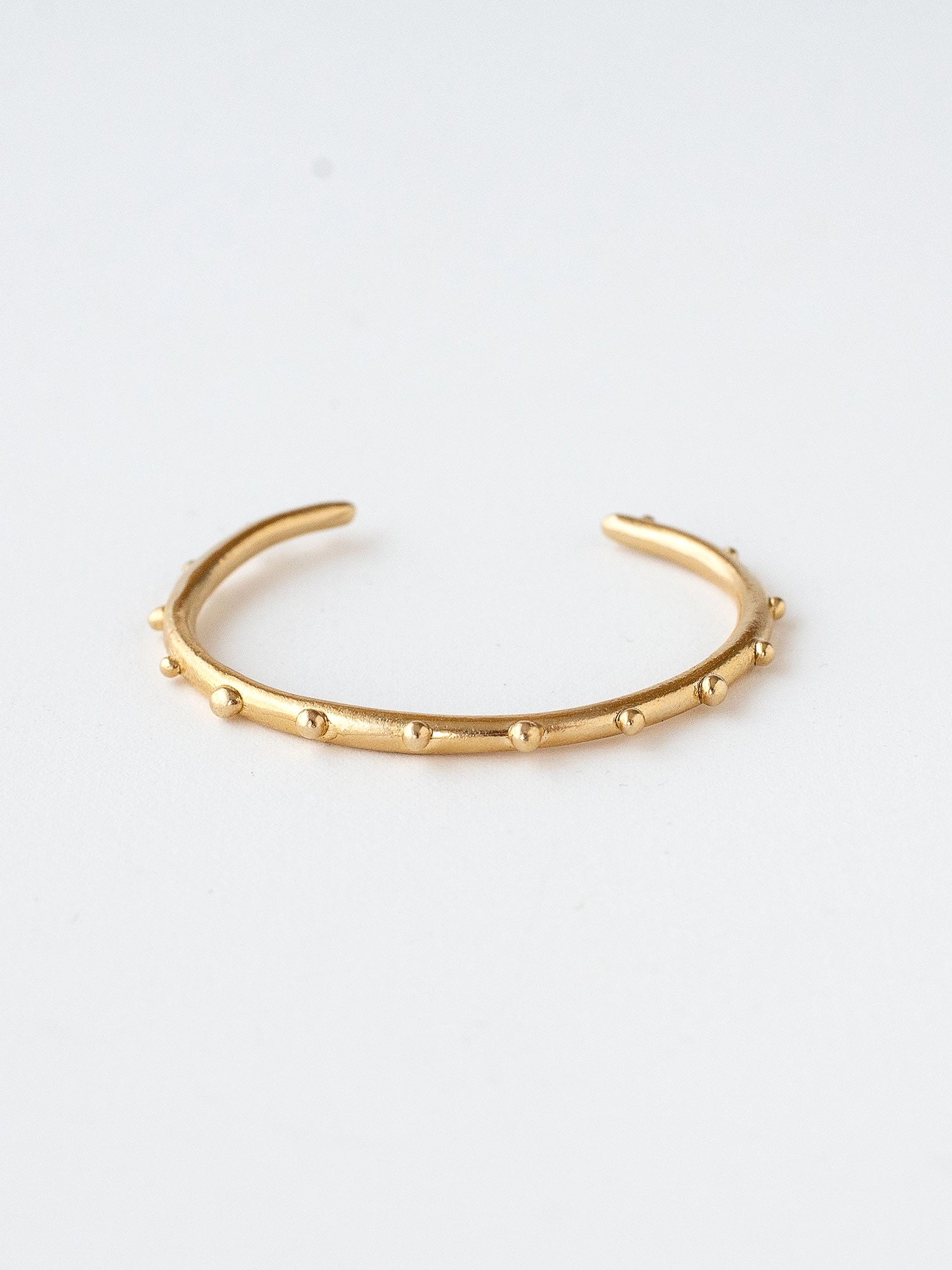 A handmade brass bangle bracelet by Michelle Ross