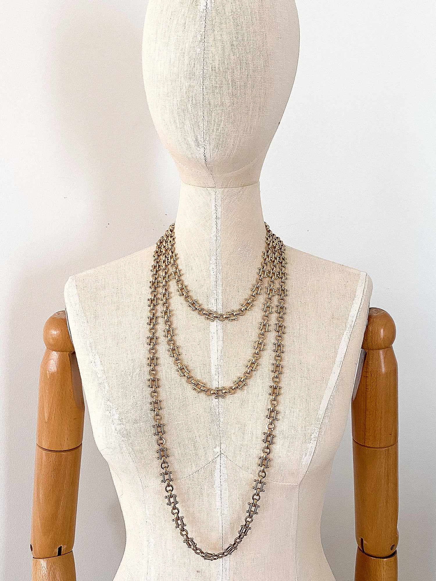 3 Brass Chain Necklaces on a mannequin by Michelle Ross